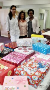 Pictured: Sandra Achary, Ini Naidoo and Millicent Khumalo who coordinated the project with some of the boxes contributed by Library staff